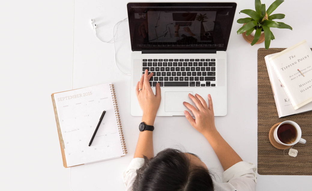 girl typing on laptop